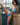 Woman in a blue bikini posing indoors with a window in the background
