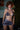 Woman wearing a patterned bikini in an indoor setting