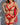 A woman wearing a red lingerie set with lace details and a G-string design.