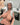 A realistic sex doll with Silver hair, in nude The doll has a lifelike appearance with detailed features, including a prominent bust and curves.
