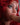 Dildo in a mouth of a sex doll with red hair.