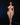 Naked woman standing against a black background with a green object on the ground.