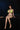 Person wearing a green bikini sitting on a dark surface