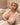 A realistic sex doll with silver hair, wearing a white shirt. The doll has a lifelike appearance with detailed features, including a prominent bust and curves.