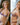 This image features a realistic adult doll designed to resemble a pregnant woman, presented in a vibrant, purple lingerie outfit. The doll is meticulously detailed, boasting a lifelike appearance with a soft, natural skin tone and a thoughtfully designed hair style that enhances its realistic look.
