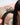 A adult doll sleeping nude on bed