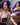 A sex doll with violet hair showing herself in a violet lingerie.