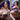 A sex doll with violet hair showing herself in a violet lingerie.