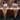 A sex doll with blue hair and violet lingerie standing in a bathroom showing herself.
