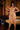 Woman in gold lingerie standing in a bedroom setting