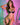 Model in strappy lingerie posing with pink and green neon lights