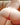 Partial view of a person wearing red underwear with a blurred background