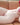 Plush toy resembling a female figure on a couch
