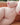 Realistic silicone doll on a brown couch