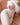 Silicone doll with a realistic design on a beige couch.