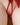 Close-up of a red lingerie set on a blurred background