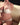 Mannequin wearing a white bra and panties set on a beige couch.