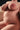 Partial view of a nude person on a neutral background