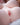 Close-up of a person's chest with a soft focus background
