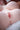 Close-up of a person's chest with a soft focus background