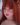 Person with red hair and fox ears wearing a blue top.