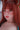 Person with red hair and fox ears wearing a blue top.