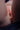 Close-up of a person's genital area with a dark background