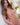 Sex doll with long brown hair in a decorative setting
