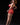 Woman in a red outfit posing against a black background with 'Ridmii' branding.