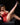 Woman in red lingerie and high heels posing on a black background with 'Ridmii' branding.