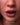 Close-up of a person's lips with 'Ridmii' branding.