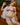This image features a realistic adult doll designed to resemble a pregnant woman, presented in a vibrant, purple lingerie outfit. The doll is meticulously detailed, boasting a lifelike appearance with a soft, natural skin tone and a thoughtfully designed hair style that enhances its realistic look.