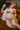 This image features a realistic adult doll designed to resemble a pregnant woman, presented in a vibrant, purple lingerie outfit. The doll is meticulously detailed, boasting a lifelike appearance with a soft, natural skin tone and a thoughtfully designed hair style that enhances its realistic look.