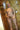 Sex doll with blonde hair and red lipstick in a bathroom setting