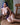 A sex doll with blue hair showing her body in a violet lingerie.