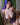 A sex doll with violet hair showing her body in a violet lingerie.