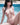 Person sitting by a pool with a blurred background