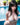 Woman in a white bikini by a pool with plants in the background