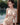 Woman sitting by a window with a blurred outdoor background