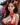 Woman in a traditional red and gold dress with a blurred background