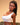 Woman wearing a white top against a beige background