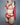 Side profile of woman in red bra with garter lingerie