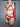 Side profile of woman in red bra with garter lingerie