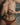 Person wearing orange underwear with a blurred background