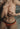Person wearing orange underwear with a blurred background