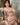 Person wearing a satin robe in a bathroom setting