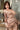 Person wearing a satin robe in a bathroom setting