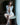 Woman sitting on a chair wearing a revealing outfit with a blurred background