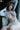 Person wearing a white outfit with a blurred background