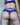 Person wearing blue lingerie with a visible brand logo on a neutral background
